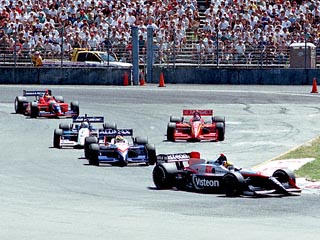 Pruett leading de Ferran through Traffic